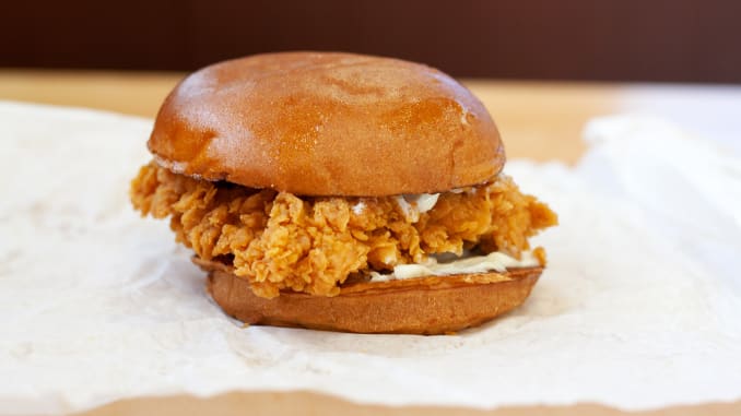 The chicken in Popeye's sandwich crunches audibly when you bite in, with all those nooks and crannies on the surface shattering into a thousand delicious pieces.